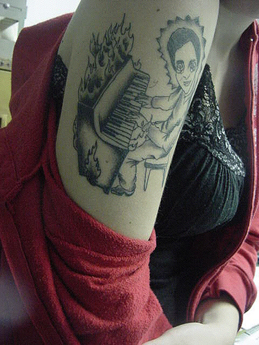 piano tattoo. tattoo work by Drew Norton